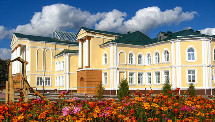 building of beautiful school on a background of flowers